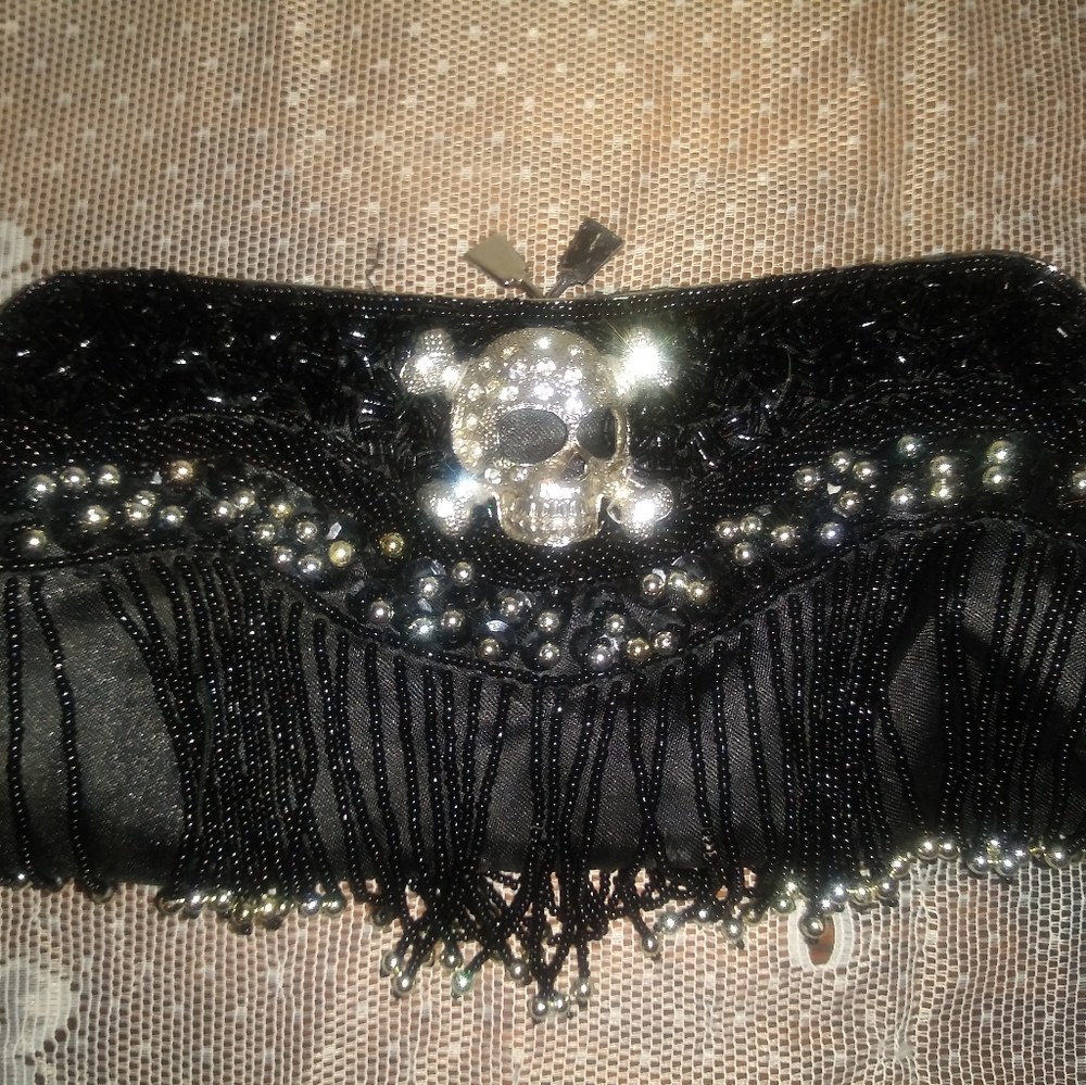 Black jeweled fringed skull clutch with rhinestone